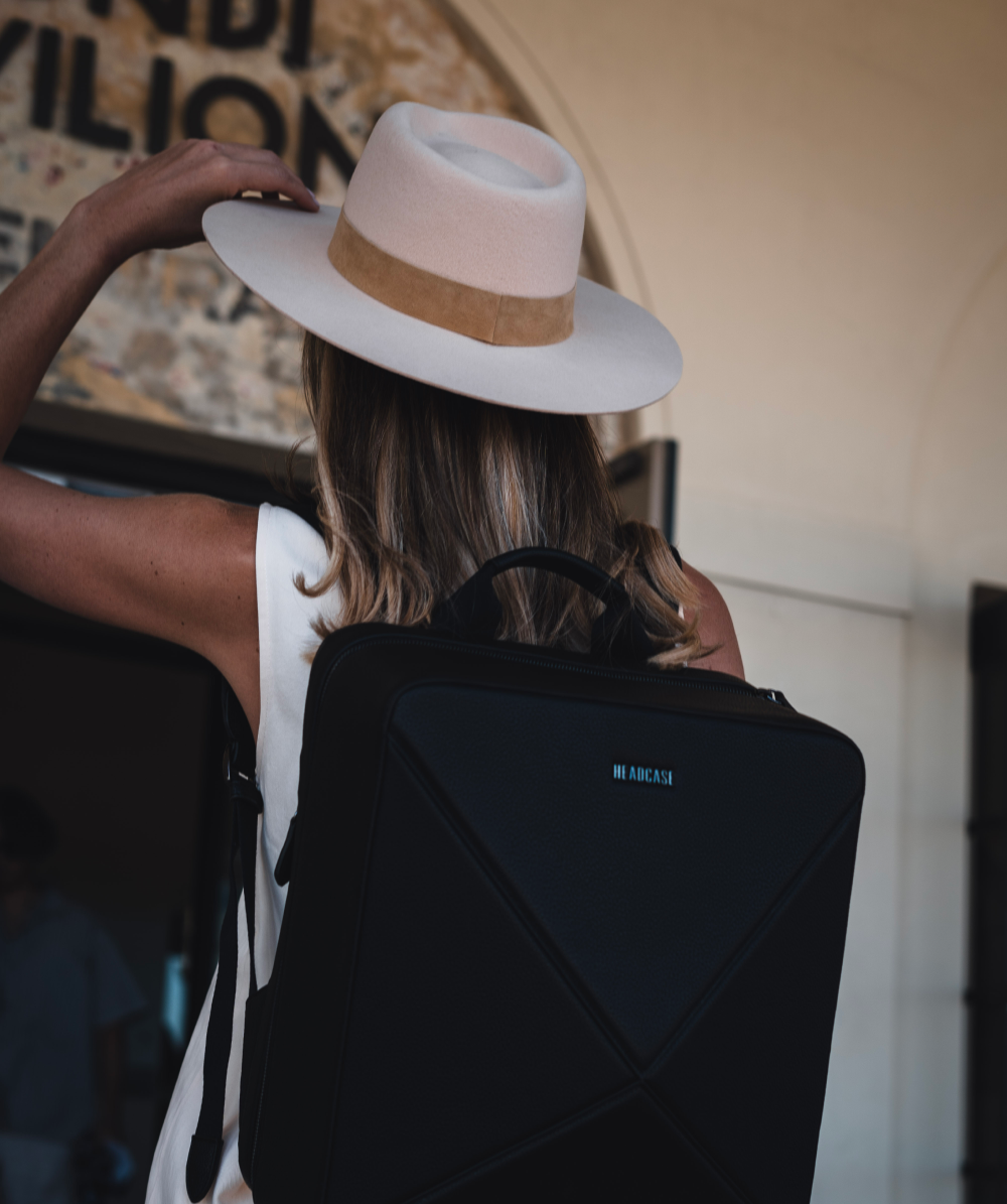 headcase backpack byron boho noir black backpack on model with hat